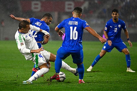 2024–25 UEFA Nations League, Israel vs Italy: Mateo Retegui, left, challenges for the ball with Mahmoud Jaber